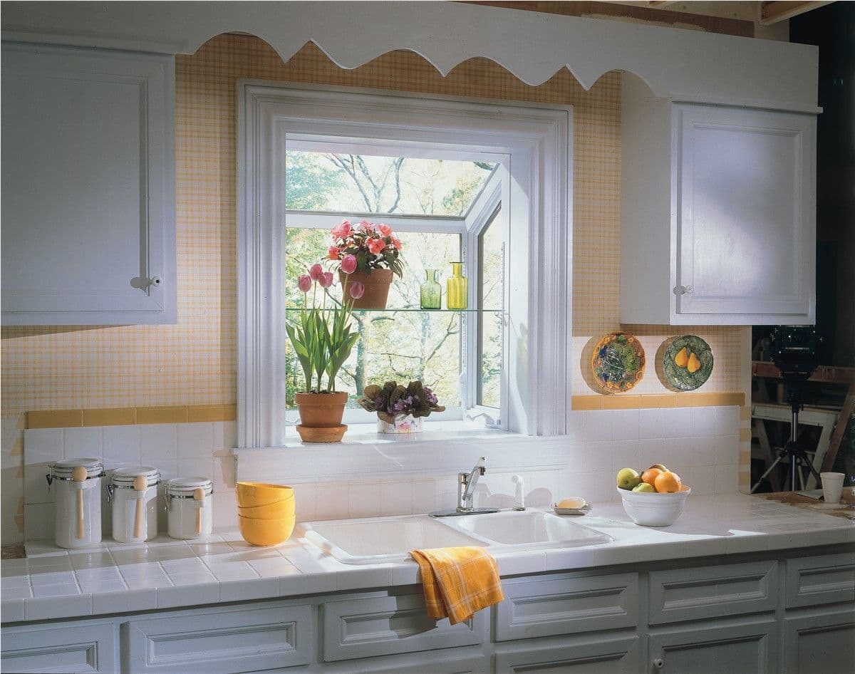 Year-round herbs are a charming addition to your kitchen, and garden windows make it possible