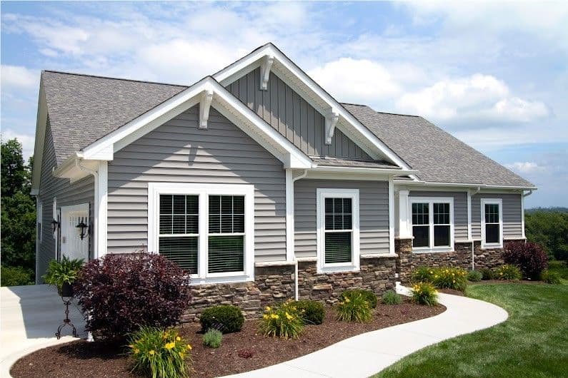 House with grey siding and plants